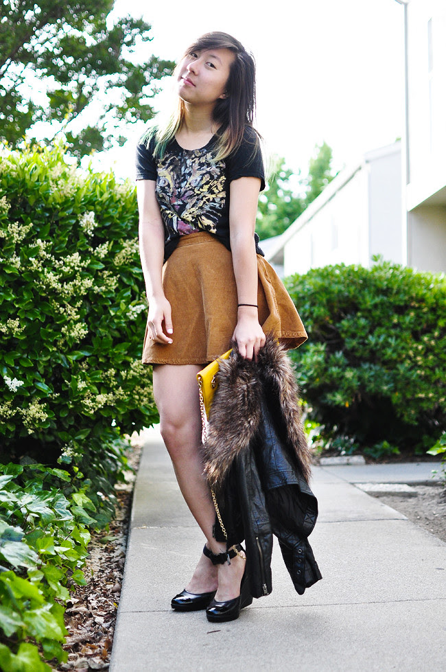 H&M faux leather crop jacket, H&M fur, Urban Outfitters tiger tee, American Apparel corduroy circle skirt, Nine West ankle-strap wedges, gifted yellow clutch