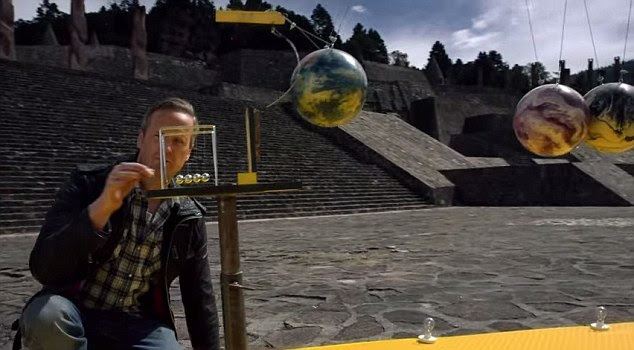 National Geographic UK has created a large Rube Goldberg Machine. The contraption begins with a simple Newton's Cradle (shown), but it quickly escalates to bigger and bigger designs