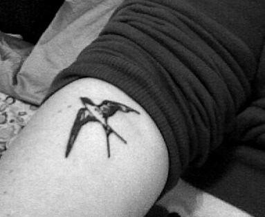 swallow wood-cut tattoo