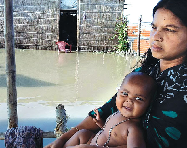 A flood-affected family in Goroimari village in Assam's Kamrup district (JHAI FOUNDATION)