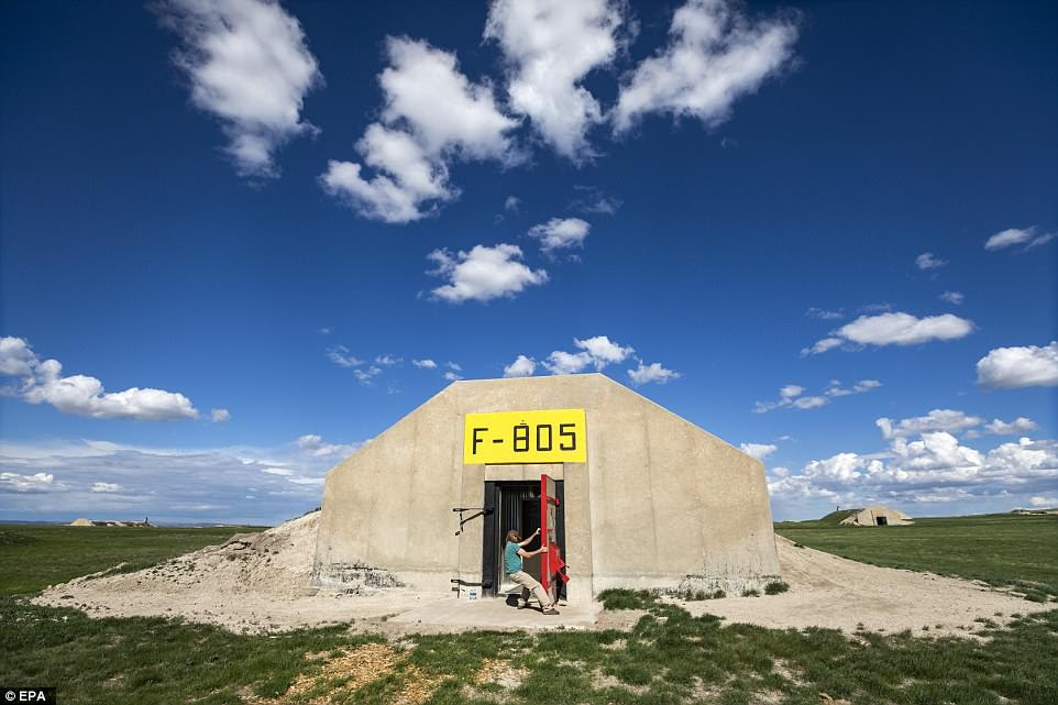 Lyle Goodman closes the door on a former US Army munitions bunkers, which a developer is repurposing into a doomsday community for civilians called Vivos xPoint, near Edgemont, South Dakota. Vivos estimates that its 575 bunkers can hold 5,000 people, making it 'the largest survival community on earth'