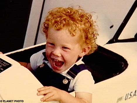 Curly locks: How the young Rhydian looked before he reached for the bleach 