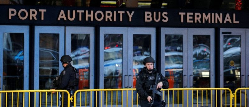 Police officers stand guard outside the New York Port Authority Bus Terminal in New York City, U.S. December 11, 2017 after reports of an explosion. REUTERS/Lucas Jackson