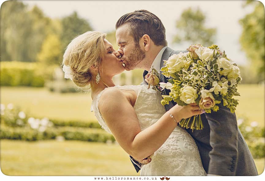 Groom kissing bride - www.helloromance.co.uk