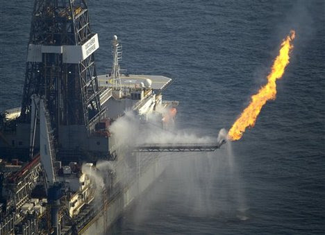 Gas is flared off on the Discovery Enterprise drilling ship which is collecting oil at the site of the Deepwater Horizon oil spill in the Gulf of Mexico off the Louisiana coast Wednesday, June 9, 2010.