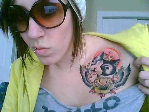 Tattoo at girl shoulder 