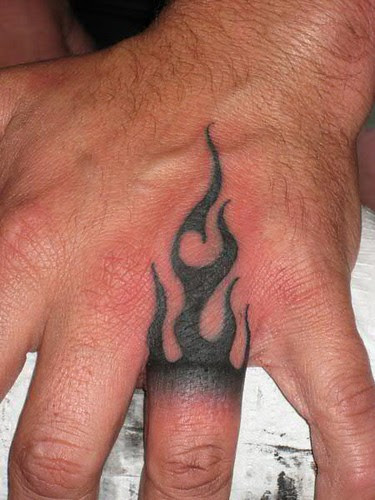 Tribal Flame hand tattoo by Jon Poulson