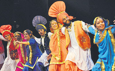 NRIs perform a folk dance at the Tagore Theatre in Chandigarh on Tuesday. 