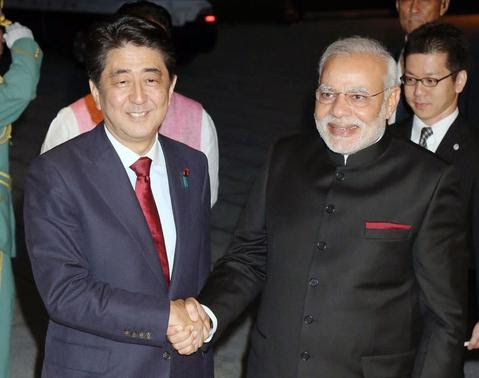 India's Prime Minister Narendra Modi (front R) shakes hands with Japan's Prime Minister Shinzo Abe upon his arrival at the State Guest House in Kyoto, western Japan, in this photo released by Kyodo August 30, 2014. REUTERS/Kyodo