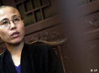 FILE -- In this Sept. 28, 2010 file photo, Liu Xia, wife of Chinese dissident Liu Xiaobo, speaks during an interview in Beijing, China. Liu Xia, the wife of Nobel Peace Prize winner Liu Xiaobo, said in a Twitter message that she had been under house arrest since Friday Oct. 8, 2010. (AP Photo/Andy Wong/file)