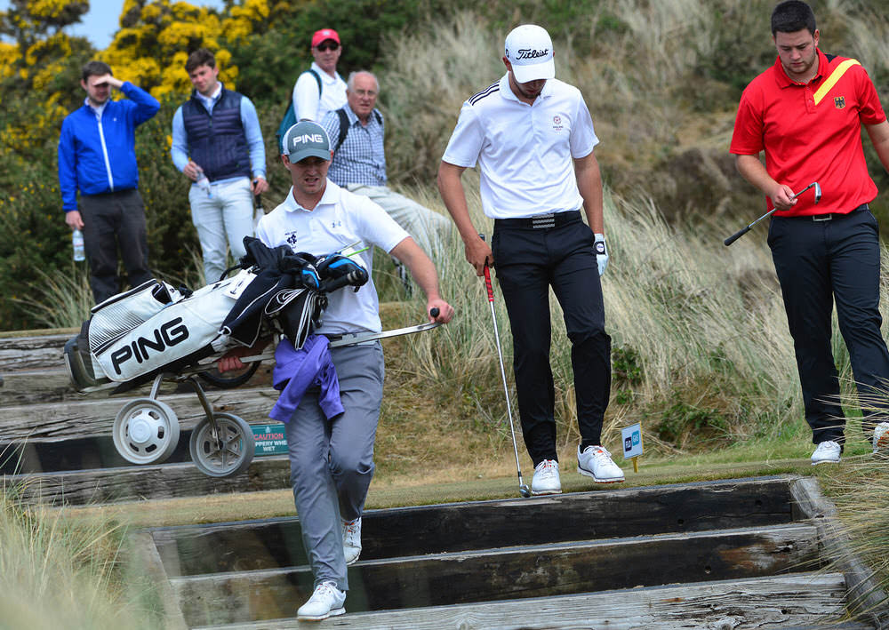 Conor O'Rourke carries his club down some steps at Royal County Down earlier this month. Picture: Pat Cashman