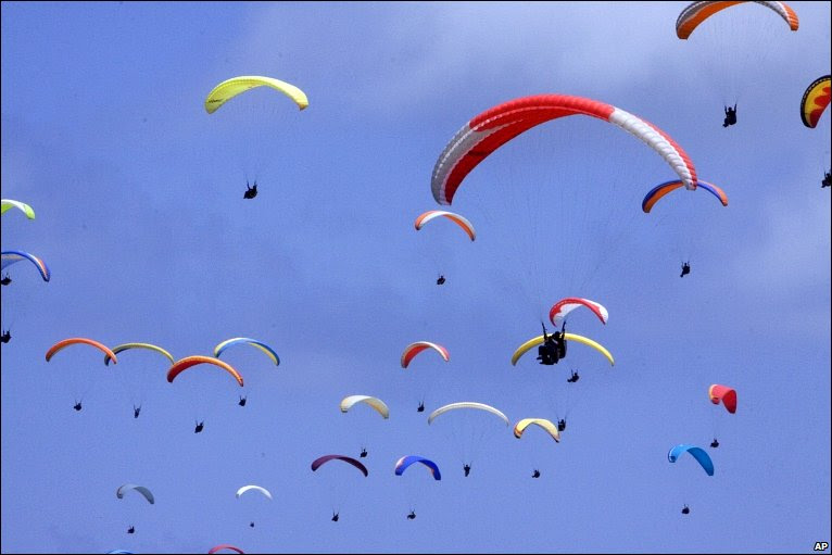 Ninety-nine paragliders in the air at Nusa Dua, Bali, Indonesia