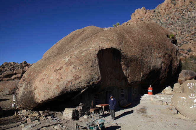 Benito Hernandez, his wife Santa Martha de la Cruz Villarreal and their family live in an odd sun-dried brick home with a huge 40 meter diameter rock used as a roof.