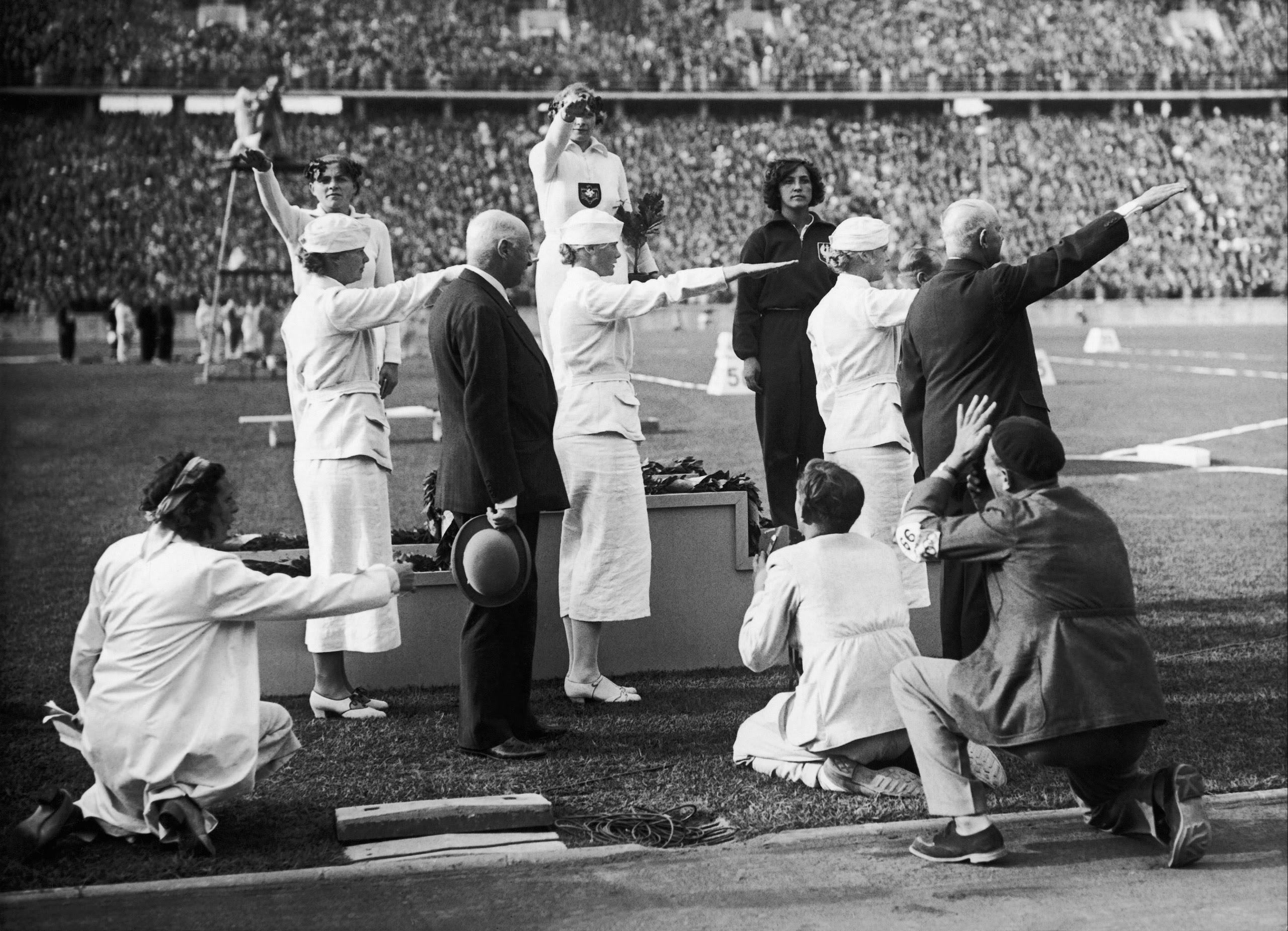 The German female javelin throwers Tilly Fleischer (Gold Medal) and Luis Kruger (Silver Medal) with Polish bronze-medalist Marja Kwasniewska, on the podium at the Olympic Games In Berlin on Aug. 2, 1936. [2560 X 1850]