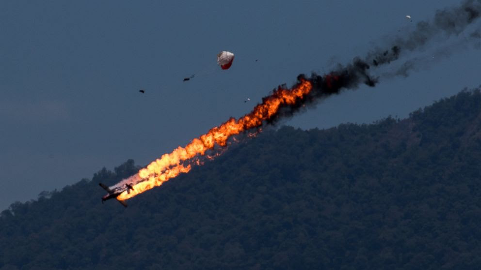 PHOTO: Two planes with an Indonesian aerobatics team collided while practicing for an airshow in Malaysia on March 15 2015.