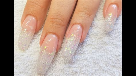 acrylic nails nude acrylic rainbow glitter fade nail