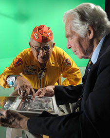 Dr. Lindberg & veteran looking at a document.
