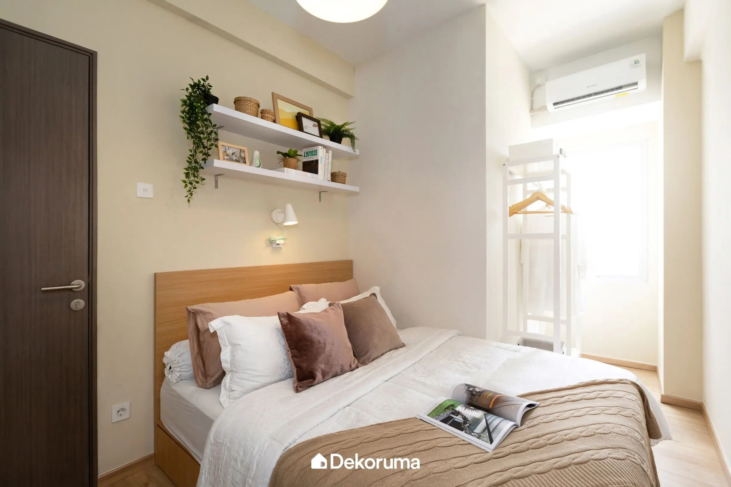 Wall shelves and hangers as a decoration for a small bedroom
