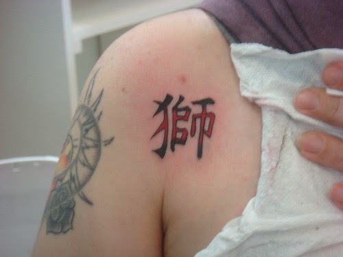 Sun Tattoo at Girl Arm 
