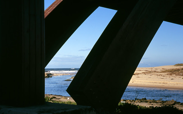 At the foot of the bridge
