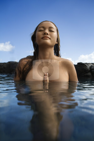Nude woman in water stock photo Young Asian nude woman partially submerged