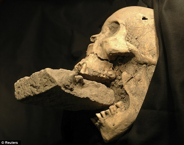 The remains of a female 'vampire' from 16th-century Venice, buried with a brick in her mouth to prevent her feasting on plague victims