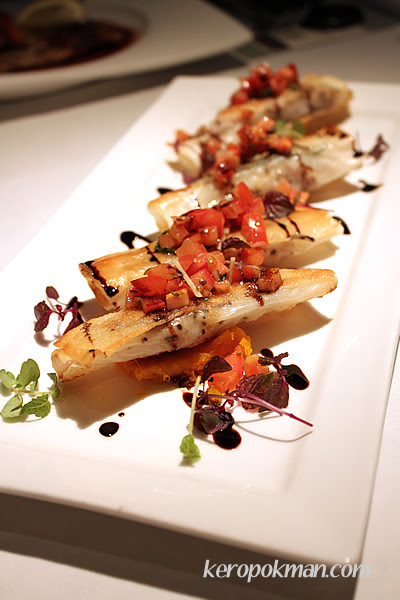 Sea bream blanketed with crispy brick phyllo on butternut pumpkin puree top with tomato salsa