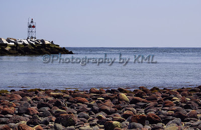 the rock jetty in the ocean harbor