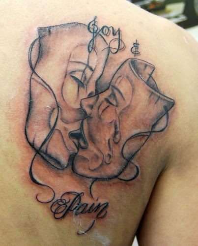 boog joy and pain masks tattoo Tattooed by Johnny at The Tattoo Studio boog joy and pain masks tattoo Tattooed by Johnny at The Tattoo Studio