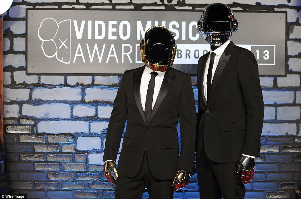 Who's that duo: Daft Punk sported suits and their customary helmets as they arrived at the venue