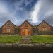 Three Houses with a Grass Roof