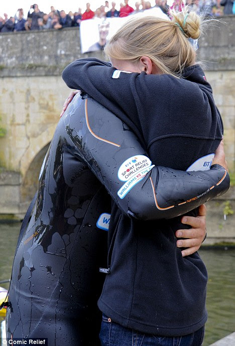 Relief: Lara and David flung themselves into each others arms as he climbed out the water