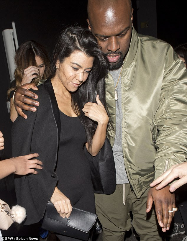 Chic star: Adding a touch of smart chic to her wardrobe Kourtney donned black blazer with grey grey detailing, which she wore shrugged over her shoulders