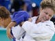 Rousey tries for a throw as she battles Netherlands' Edith Bosch in their third-round match at the 2008 Beijing Olympics. Rousey lost the match.