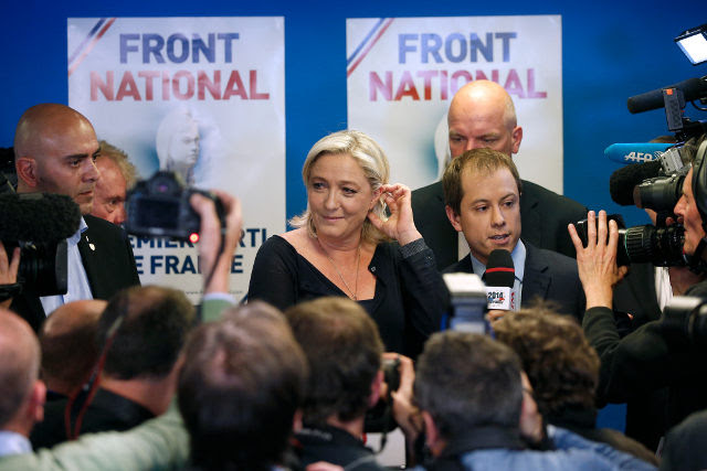 VICTORY. Marine Le Pen leaves the stage after delivering her speech after the far-right National Front is the top vote winner in France's election for the European Parliament, near Paris, France, May 25, 2014. Yoan Valat/EPA