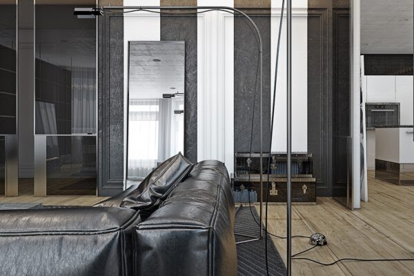 Its black leather sofa is enormous and begging to be sunk into.