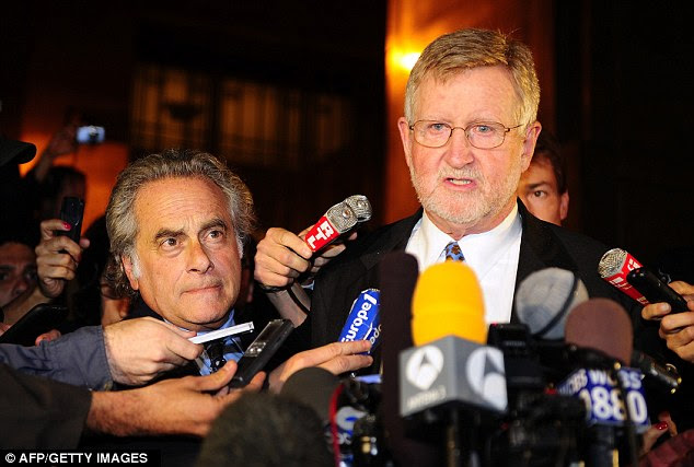 Delay: William Taylor, right, and Benjamin Brafman, left, attorneys for Mr Strauss-Kahn, talk to the press outside the Manhattan Criminal Court in New York last night