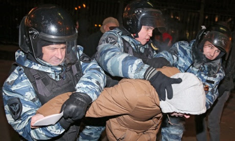 A group of police officers detain one of Alexei Navalny’s supporters at the rally. 
