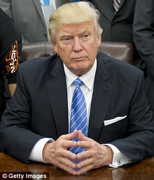 US President Donald Trump (above) is expected to sign several executive orders on Wednesday restricting immigration from Syria and six other Middle Eastern or African countries