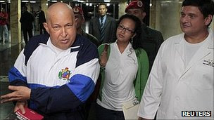 Hugo Chavez, left, in hospital in Caracas
