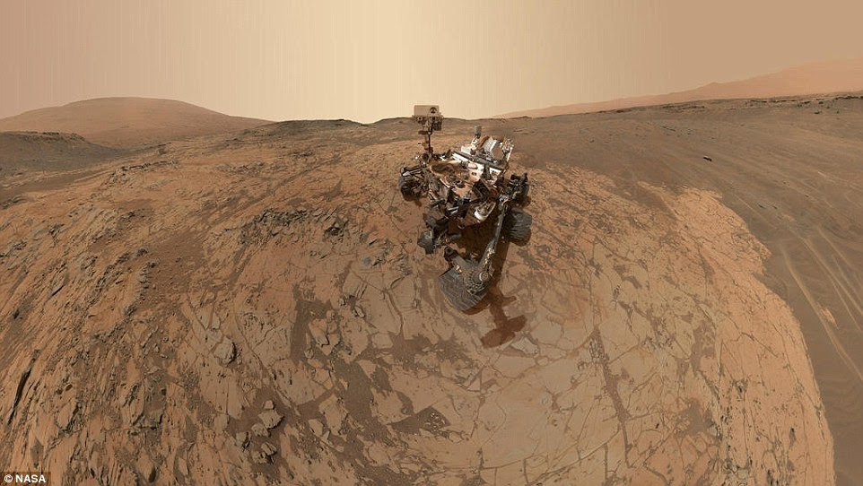 Curiosity has now been on Mars for almost 1,000 days, having landed on 6 August 2012. Shown here is a mosaic of images creating a self-portrait of the rover, which makes it look like someone else has taken it