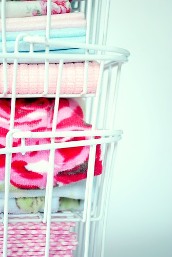 Baskets of cleaning cloths, dusters and towels