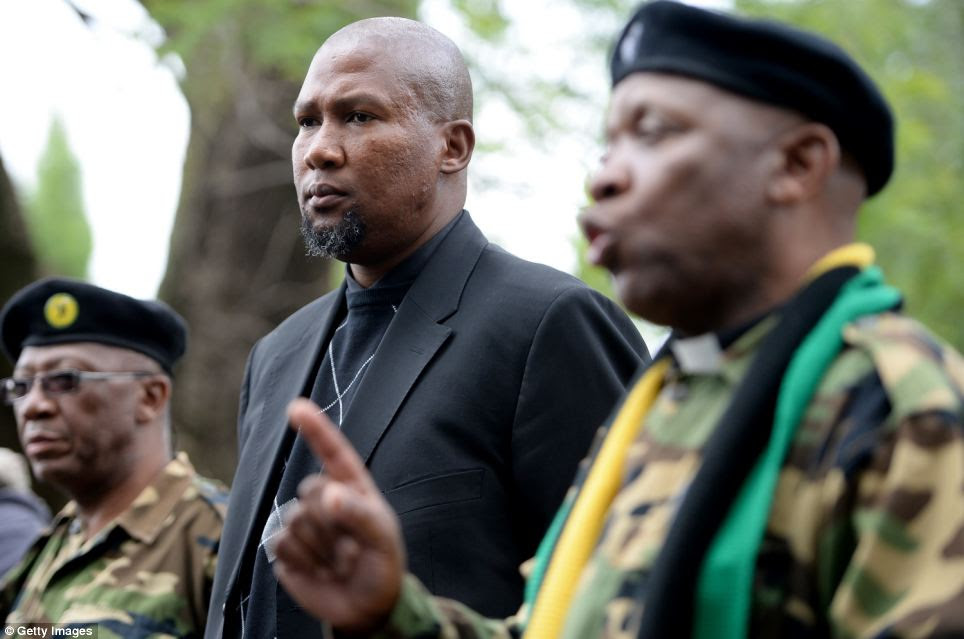 Mandla Mandela the grandson of Nelson Mandela prays with MK members outside the former president's Houghton home