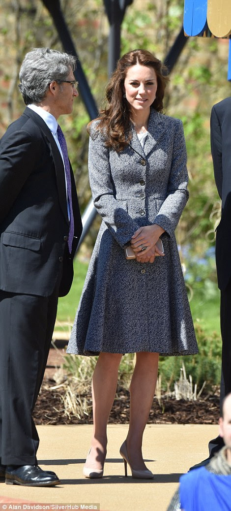 Despite the warm early summer weather, Kate was wearing a thick blue coat by Michael Kors - an old favourite