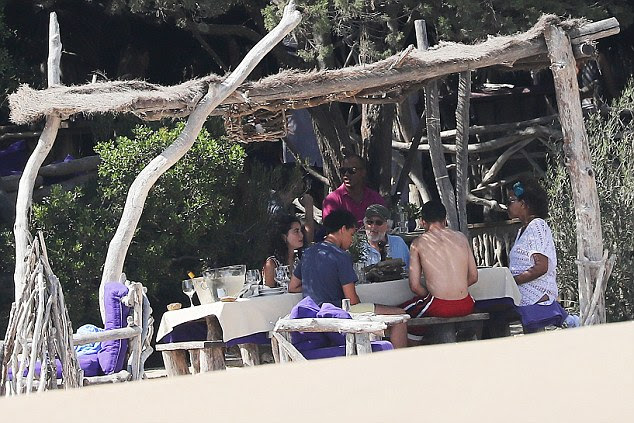 Rustic: The family group looked relaxed and happy during their beach break 