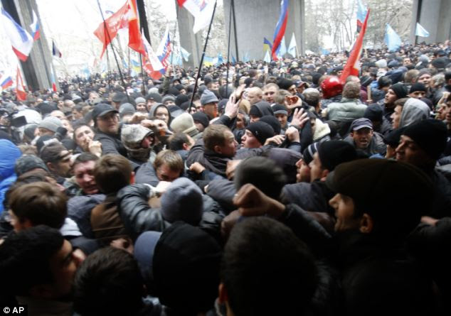 Blows were exchanged by groups arguing over the future of their country as Putin readies his troops