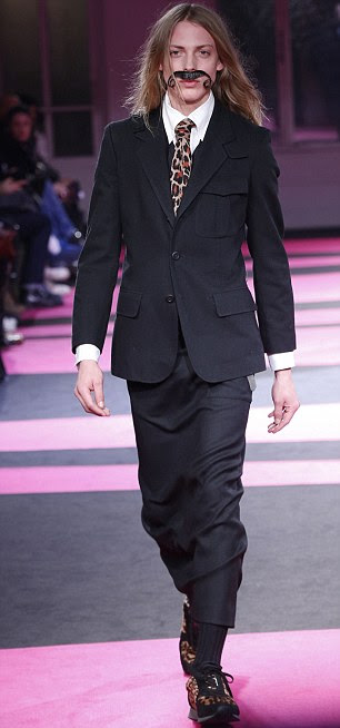 Back to the day job? Pejic's manly new look is a far cry from his usual made-up style