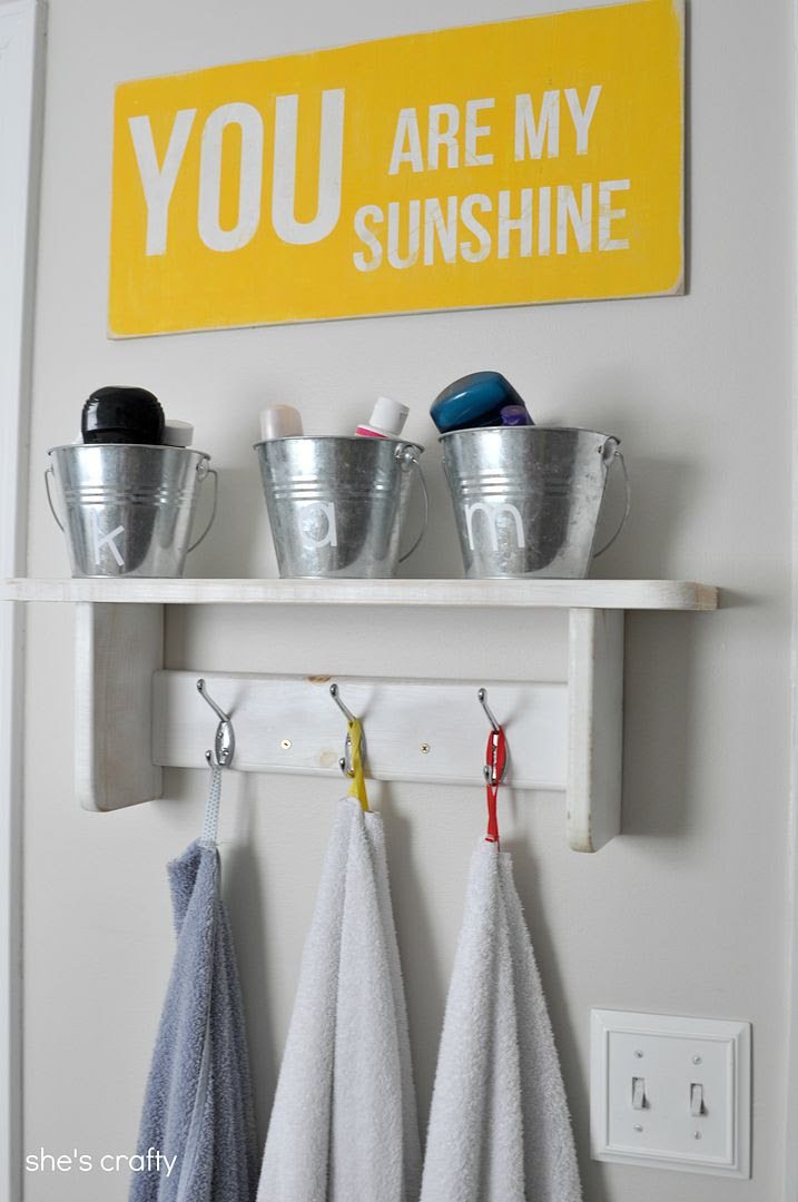 kids bathroom, bathroom decorations, buckets for storage, towel hanging shelf