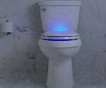 Toilet with blue light illumination in seat.