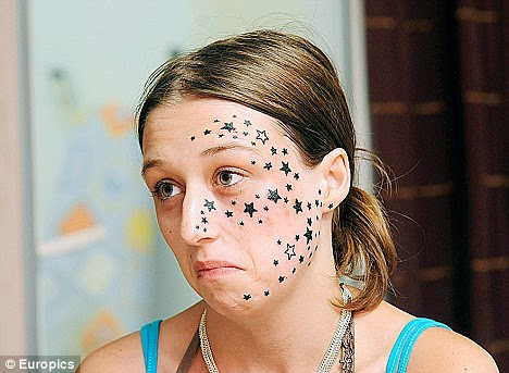 Amid a frenzy of media attention, she then vowed to sue tattoo artist 